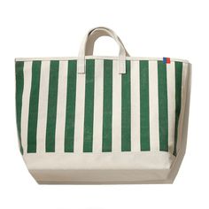 a green and white striped tote bag on a white background with the handles down