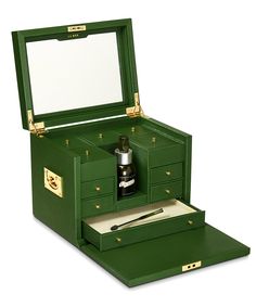 an open green box with writing utensils in it