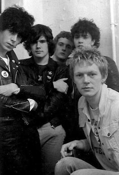 a group of young men sitting next to each other