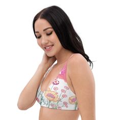 Summer adventures with a little extra lift! This vanilla flower recycled padded bikini top is extremely comfortable and includes pads you can remove. To make this top even more versatile, mix and match it with different layers, including it's coordinating UPF Long Sleeve. Padded cups without wires for ultimate comfort Supportive design for active beach days or poolside relaxation Made from sustainable recycled materials Mix and match with other pieces in the collection Provides freedom of moveme Summer Swimming Bra With Removable Pads, Summer Bra With Removable Pads For Sunbathing, White Summer Swimwear With Removable Bra Pads, Summer Vacation Bra With Padded Cups, Summer White Sports Bra With Removable Pads, White Sports Bra With Removable Pads For Summer, White Sports Bra With Removable Pads, Triangle Top Sports Bra With Removable Pads, Vacation Beach Bra With Removable Pads