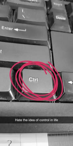 a computer keyboard with a red circle on it