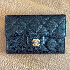 Brand New Chanel Interlocking Cc Logo Wallet. Black Caviar Leather Featuring Champagne Gold Hardware. Purchased By My Mom As A Gift In Paris Boutiques. Comes In Original Packaging. Luxury Coin Purse With Card Slots In Pouch Shape, Luxury Coin Purse With Card Slots, Luxury Textured Leather Clutch For Daily Use, Luxury Rectangular Coin Purse For Travel, Luxury Textured Leather Wallets, Channel Wallet, Luxury Rectangular Wallets For Everyday Use, Luxury Compact Wallets For Daily Use, Luxury Travel Clutch Wallet