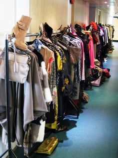 a clothing rack filled with lots of clothes