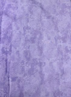 a purple rug is laying on the floor