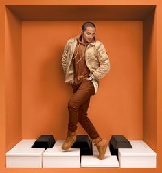 a man standing on top of a white box