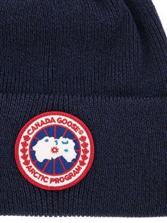 a beanie with the canadian goose logo on it