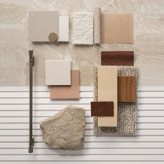 the wall is covered with different types of tiles and materials that look like stone or wood