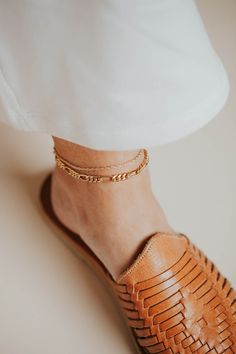 An ankle accessory must-have! This braided rope chain is chic and effortless. Minimal and quaint all on her own, but layers beautifully with others! Choose from two sizes: 8.5"-9" and 9.5"-10". Available in 14kt Gold Fill + Sterling Silver. Love this anklet? Shop our Goldie Chain and Goldie Bracelet. Handmade in Eau Claire, WI. Our jewelry is handmade so each piece will be unique and may vary slightly from what is pictured. Ankle Accessories, 90s Accessories, Everyday Wear Jewelry, Braided Rope, Handmade Jewelry Designs, Chain Anklet, Bracelet Handmade, Link Necklace, Rope Chain