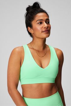 On-The-Go Midi Medium Impact Sports Bra Fabletics green female Activewear >> Womens >> Sports Bras >> Sports Bra >> Medium Impact regular Medium-impact style with cut-out detail Green Sports Bra With Light Support, Green Compressive Activewear For Workout, Casual Green Sports Bra With Light Support, Green Activewear For Light Exercise, Green Compressive Sports Bra For Light Sports, Green Compressive Sports Bra For Gym, Green Fitted Sports Bra For Athleisure, Green Athleisure Sports Bra For Gym, Green Medium Support Sports Bra