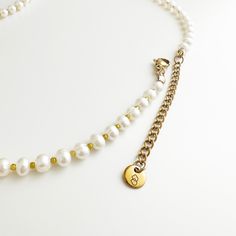 Elevate your style with our Danielle Pearl Necklace, featuring hand-picked freshwater potato pearls and small gold beads. The delicate design showcases the natural beauty of the pearls while adding a touch of sophistication with the gold accents. A must-have accessory for any occasion, this necklace is both cute and elegant. Handmade in San Francisco. Material: 0.2"/5mm freshwater pearls, gold-plated beads Length: 14"/355mm with 2"/50mm chain extender, total 16"/400mm Chain Extenders, Delicate Design, The Gold, Showcase Design, Hand Picked, Gold Beads, Gold Accents, Freshwater Pearls, Potato