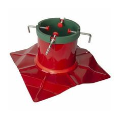 a red and green bird feeder sitting on top of a plastic mat with two screws