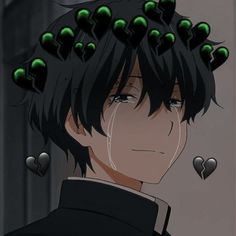 a man with black hair and green eyes has many hearts on his head as he stares at the camera