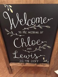 a chalkboard sign that says welcome to the wedding of choe and lewis