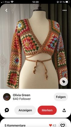 a crocheted top on a mannequin's torso with the words mehren written in german