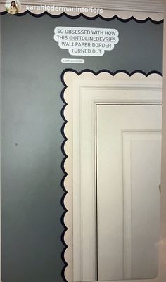 a white door with scalloped trim on it