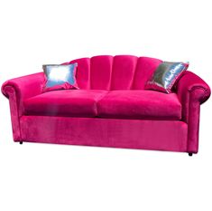 a pink couch with two pillows on it