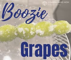 the words boozie grapes are in front of a glass plate with food on it