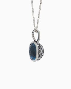 The Square Stone Pendant features a faceted London blue topaz stone set in sterling silver with a unique petroglyph texture. Take notice of the twisted detailing on the bail which adds a playful touch. Pair with your favorite chain, sold separately. Metal: Sterling silver Stone: London blue topaz Dimensions: 23mm x 14mm Stone Size: 12mm x 12mm Style #: P246Lb Topaz Birthstone Jewelry With Round Stone, Sterling Silver Birthstone Oval Pendant Jewelry, Oval Topaz Birthstone Jewelry, Elegant Topaz Jewelry With Polished Finish, Polished Topaz Fine Jewelry, Sterling Silver Jewelry With Diamond Cut Round Stone, Fine Jewelry In Polished Topaz, Fine Jewelry With Polished Topaz, Fine Jewelry With Faceted Topaz