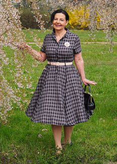 "This swing dress is a 50s inspired shirtwaist dress , featuring classic open neck, notched collar, and center front button closure, finished with a swing skirt, and handy side seam pockets. DETAILS * 100% linen * Two seam pockets * Front button up closure * Short sleeve * Collared collar * Below knee Length * Perfect for Spring, Summer * Wash by hand or machine with cold water * The model is 175cm (5′9″) tall with a 80cm (31.5\") bust, 66cm (26\") waist. She is wearing the plaid dress in size X Vintage 1950s Collared Dress, 1950s Style Knee-length Dress With Button Closure, Summer Belt, Pockets Details, Shirtwaist Dress, Linen Shirt Dress, Open Neck, Linen Midi Dress, Wool Clothing