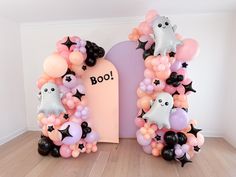 balloons are arranged in the shape of letters with ghostes and bats on them,