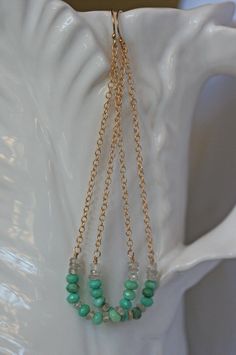 Summer swing earrings are just the right amount of dangle, color and sparkle to wear everyday this summer. The smiling swing is beaded with faceted Chrysoprase in a lovely shade of greenish blue paired with clear faceted Zircon. All the gemstone are natural and have tiny facets for extra sparkle. The summer swing earrings come in several gemstone color ways: The Chrysoprase earrings are available in Sterling Silver and 14k gold filled and come in two lengths; 2 3/4 inch and 3 3/4 inch. The 3 3/4 Summer Beaded Chain Dangle Earrings, Elegant Summer Jewelry With Faceted Beads, Long Drop Beaded Chain Earrings As Gift, Summer Jewelry With Dangling Beads And Long Drop, Summer Faceted Beads Dangle Jewelry, Summer Long Drop Earrings With Dangling Beads, Summer Faceted Beads Dangle Earrings, Turquoise Beaded Chain Drop Earrings, Shoulder Duster Earrings