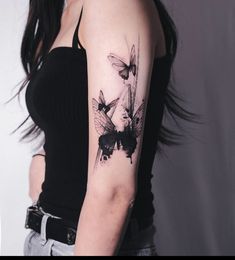 a woman with a tattoo on her arm