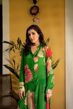 Editor's Note Featuring a green printed kurta having a button front placket with shirt collar, long sleeves and side slit, it is teamed with pants. Color: Green Fabric: Crepe Component: Kurta and pant Fit: Fitted at waist Occasion: Festive and wedding guest Care: Dry Clean Only About the Designer Paulmi & Harsh is a luxury prêt label inspired by beautiful botanicals. Paulmi & Harsh design strong, feminine silhouettes with prints and delicate detailing, fusing 1950’s fashion with modern-day sensi Moody Green, 1950’s Fashion, Trendy Shirt Designs, Dress And Jacket Set, Kurti Designs Latest, Green Spring, Indian Fashion Designers, Kurta With Pants, Spring Blooms