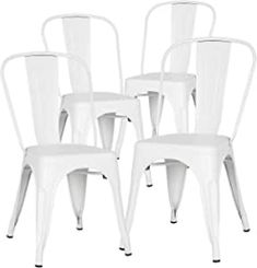 four white chairs sitting next to each other