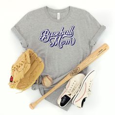 a t - shirt that says baseball mom with a bat and glove next to it