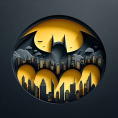 the batman symbol is cut out from paper and placed on a black surface with city lights in the background