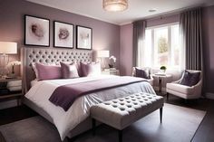 a bedroom with purple walls and white bedding, two framed pictures on the wall