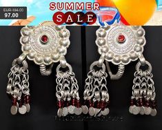 Old Afghan Silver Earrings with Red Glass Jewels. These earrings are a rare masterpiece made with high quality silver. They are rare unique collectors pieces and can be worn as well, if you love extravagante and eccentric ethnic statement jewelry and if you can stand the weight. These earrings also habe loops at the top, so you can sew them to a turban or other headdress.One of the earrings has a matte spot on the top right, please have a close look at the pictures. Lenth 6,5 cm / 2,56 ", Diamet Nickel-free Traditional Summer Jewelry, Red Vintage Jewelry For Summer, Traditional Red Jewelry For Summer, Traditional Red Earrings For Summer, Traditional Silver Clip-on Earrings, Red Vintage Earrings For Festivals, Afghani Earrings, Traditional Red Clip-on Earrings, Ornate Red Sterling Silver Jewelry