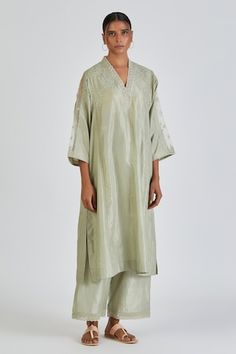 Mint green silk kurta featuring resham floral embroidery, sheer panels on sleeves and lace insert detail. Comes with matching pant. - Aza Fashions Pista Green Silk Kurta For Spring, Elegant Raw Silk Palazzo Set For Spring, Elegant Pista Green Silk Palazzo Set, Elegant Spring Raw Silk Palazzo Set, Spring Pista Green Silk Sets, Pista Green Silk Sets, Elegant Green Palazzo Set In Tissue Silk, Elegant Green Tissue Silk Palazzo Set, Pant Women