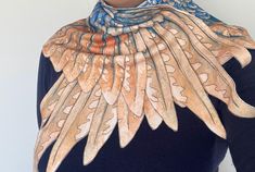 Introducing our Handmade Bird Wings Shawl, a cozy and captivating accessory that will add a touch of whimsy to your wardrobe. Crafted with care, this shawl is designed in the shape of delicate bird wings, making it a one-of-a-kind piece that's sure to turn heads. Made from high-quality synthetic fleece, our shawl is not only exceptionally warm but also incredibly soft to the touch. The fleece material ensures you'll stay snug and stylish during those chilly days and nights. What sets our shawl a Wing Shawl, Wings Making, Wing Scarf, Bird Wings, Fantasy Costumes, Kawaii Fashion, Scarf Shawl, Keep It Cleaner, Scarf Wrap