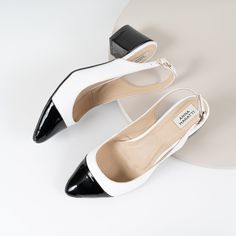 "Ella - beautiful sling-back block heels, classic model black & white. The insole made of a soft calfskin ensures comfort of use. Slim sole and delicately pointed toes optically slim feet.  Love at first look.... Whatever your style, I can guarantee that pumps will suit your look and add a final touch of polish. The sling-back pumps look just as good with casual jeans, dress or evening outfit.  BRAND: Anna Maratti  MATERIAL: white grain leather and black patent leather LINING: calf leather SOLE: synthetic FIT: regular width HEELS HEIGHT:  5 cm = 2\"   Sizes US, EU, UK and feet dimensions 5 US / 36 EU / 3 UK insoles length 23.5 cm = 9.2 inches 6 US / 37 EU/ 4 UK insoles length 24 cm = 9.5 inches 7 US / 38 EU / 5 UK insoles length 24.5 cm = 9.7 inches 8 US/ 39 EU/ 6 UK insoles length 25.5 cm White Slingback Sandals With Contrasting Heel Counter, White Block Heels With Contrasting Heel Counter, Black High Heel Slingback Pumps With Rubber Cap, White Ankle Strap Slingback Sandals For Work, Chic Black Slingback Pumps With Rubber Heel Cap, White Slingback Pumps With Sculpted Heel For Office, Formal Black Slingback Pumps With Rubber Heel Cap, White Pointed Toe Slingback Pumps For Work, White Block Heel Slingback Pumps For Work