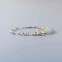 Fall in love with our delicate Montana sapphire gemstone beaded bracelet, so sparkly in the silvery gray shade with a hint of blue, perfect timeless delicate minimalist design, designed to be stacked or worn on its own. Will make a thoughtful birthday, christmas. anniversary gift for your wife, mother, sister, daughter, or friend. Your purchase will arrive elegantly packed  in a gift-ready suede storage bag  and will include a complimentary cleaning cloth. Treat yourself or your loved ones with September Birthstone Jewelry, Montana Sapphire, Gemstone Beaded Bracelets, Sapphire Bracelet, September Birthstone, Dainty Bracelets, Sapphire Gemstone, Birthstone Jewelry, Bridesmaid Gifts