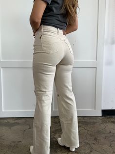 Step up your denim game with More To Come High Waist Distressed Wide Leg Jeans. With a flattering high waisted fit, these bone colored jeans feature a distressed design for a touch of edge. Zip fly closure, functional pockets, and belt loops add convenience to the stylish wide leg silhouette. Made with soft and comfortable material, these jeans are perfect for any casual or dressy occasion. More to come indeed! DETAILS Brand: Judy Blue Bone wide leg jeans High waisted fit Distressed design Zip f Chic High Rise Beige Flare Jeans, Chic High Waist Beige Flare Jeans, Chic Beige High-waist Flare Jeans, Chic Cream Flare Jeans For Fall, Fitted Mid-rise Cream Jeans, Beige High Waist Flare Jeans For Fall, Fitted Cream Jeans With Five Pockets, Fitted Cream Jeans, Beige Wide Leg Denim Jeans