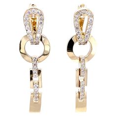 0.82 Carat Diamond 14 Karat Yellow Gold Dangle Earrings These on trend, yet classic earrings are sure to be a great addition to your accessory collection! There are 66 Round Cut Diamonds that weigh 0.82 Carats (Clarity: SI2, Color: F) Made in 14K Yellow Gold weighing approximately 7.1 Grams. They are about 1.5 inches in length with a latch back closure designed for an easy and secure wear. Luxury Traditional Clip-on Earrings For Anniversary, Traditional Earrings, Gold Dangle Earrings, Classic Earrings, Link Earrings, Gold Earrings Dangle, Cartilage Earrings, White Diamonds, Chandelier Earrings