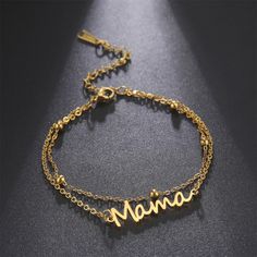 Keep your beloved mom close to your heart with this stylish bracelet. Crafted from stainless steel, the bracelet features a mama nameplate, and is available in either gold or silver colors, or in string colored red or black. Perfect for any mom, it is a wonderful way to show her that she is loved. Minimalist Stainless Steel Bracelets For Mother's Day, Trendy Personalized Stainless Steel Bracelets, Adjustable Stainless Steel Name Bracelet For Everyday Wear, Adjustable Stainless Steel Name Bracelet For Everyday, Custom Name Stainless Steel Bracelet, Trendy Metal Bracelets For Mother's Day, Adjustable Gold Stainless Steel Name Bracelet, Gold Custom Name Bracelet In Stainless Steel, Mother's Day Metal Bracelets With Adjustable Chain