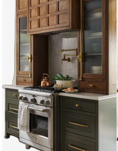 a kitchen with an oven, sink and cabinets in the same color as each other