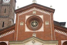 an old church with a clock tower in the background