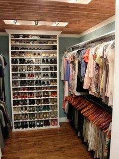 the closet is full of clothes and shoes