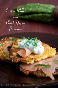 crispy millet and greek yogurt pancakes on a black plate with dill sprig