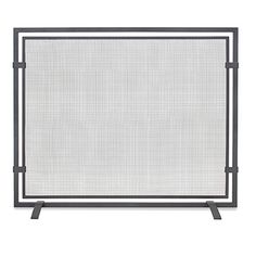 an iron fireplace screen with a white background