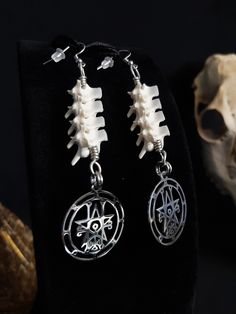 Here is a Gorgeous Pair of Sigil of Astaroth Earrings! They Were Made With Real Large Rattlesnake Vertebrae! The Hooks, Pendants and Jump Rings are All Stainless Steel. They Are Around 4 Inches long. All Items Ship Within 1-3 Days via USPS Ground Advantage Service. Shipping on these will be 5.50 (USA Only) All additional items are FREE! International Shipping Will Be 22.00 + 2.00 For each Additional Item. Canada 20.00 + 2.00 For each Additional Item. International Shipping May Take 2 - 6 Weeks t Real Bone Jewelry, Earrings Gothic, Bone Crafts, Gothic Witch, Human Bones, Bone Earrings, Real Bones, Bug Art, Bone Jewelry