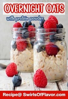 two mason jars filled with oatmeal, raspberries and blueberries