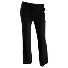 Classic and collectible for CHLOE black silk flared leg low rise trousers! Soft sturdy silk that holds shape nicely. Tailored fit, with a wider flare leg. Sits low on the hips, with button closure at waistband and zipper fly. Pockets at each side of the hips, and one pocket on the rear. Very flattering and versatile. The pictured Jean Paul Gaultier black crop top is also available in my 1stDibs Shop. Perfect for all year. In great unworn condition. Made in France Marked Size EU 36 / US 4 - 6 Mea Tailored Black Flare Wide Leg Pants, Tailored Flare Black Pants, Tailored Black Flare Pants, Black Tailored Flare Pants, Black Flare Wide Leg Pants For Office, Elegant Stretch Flares, Black Elegant Evening Flares, Elegant Black Flares For Evening, Elegant Black Evening Flares