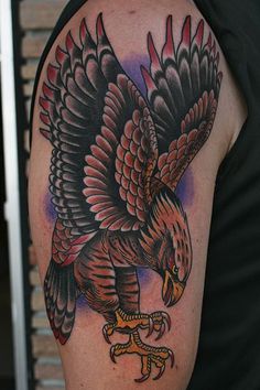 a man with a bald eagle tattoo on his arm