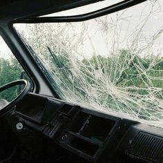 the interior of a vehicle with shattered windshield