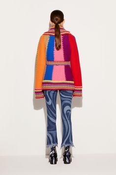 This knitted cardigan captures Pucci's penchant for vibrant hues through its rainbow-style colourblock design. It's crafted from wool to a relaxed silhouette and is finished with an appliqué at the front pocket bearing logo lettering alongside Capri's Faraglioni. Bright red, bright yellow, royal blue, bright pink Shawl lapels Long sleeves Self-tie waist belt Patch side pockets with logo appliqué Striped ribbed-knit trims Relaxed fit 100% wool Dry clean only Style ID: 4UKQ034U963A22 Model is 177cm and wears size XS Made from a midweight fabric Multicolor Wool Sweater With Patchwork, Multicolor Wool Patchwork Sweater, Multicolor Wool Outerwear For Spring, Multicolor Cotton Color Block Outerwear, Multicolor Wool Long Sleeve Cardigan, Casual Multicolor Wool Outerwear, Casual Multicolor Wool Cardigan, Multicolor Knit Color Block Outerwear, Retro Multicolor Wool Outerwear